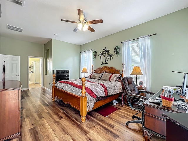 25545 Laurel Valley Rd, Leesburg, FL 34748 - bedroom featuring baseboards, visible vents, and wood finished floors