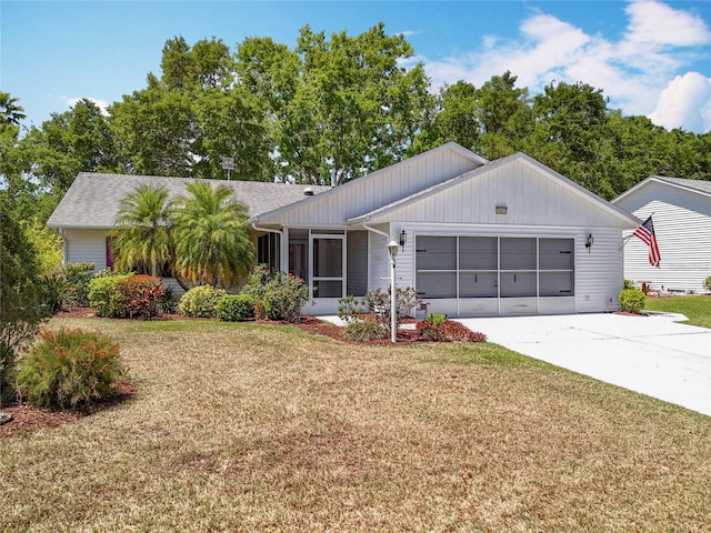 26823 Forest Hills St, Leesburg, FL 34788 - view of front of property with a front yard, driveway, and an attached garage