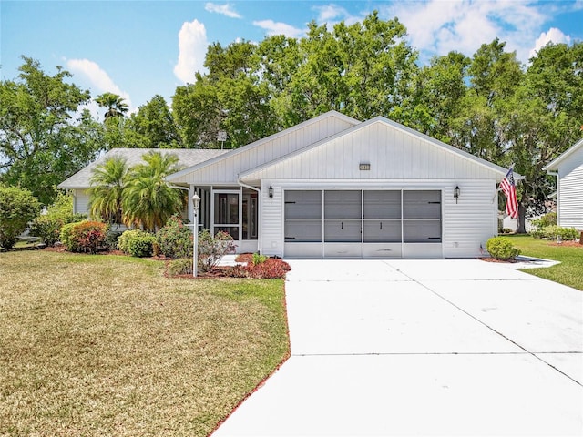 26823 Forest Hills St, Leesburg, FL 34788 - view of front of house featuring an attached garage, concrete driveway, and a front yard