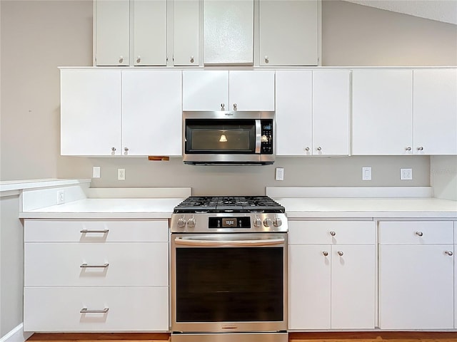 26823 Forest Hills St, Leesburg, FL 34788 - kitchen with appliances with stainless steel finishes, light countertops, and white cabinets