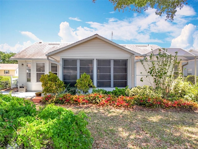 26823 Forest Hills St, Leesburg, FL 34788 - back of property featuring roof with shingles and a patio area