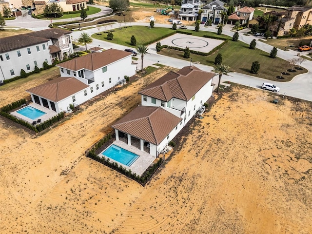 birds eye view of property with a residential view