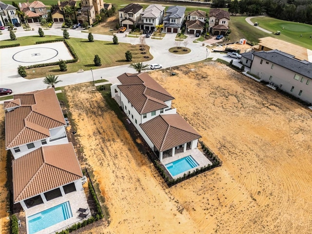 birds eye view of property with a residential view
