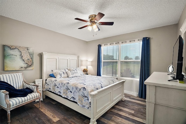 2142 Margarita Dr, The Villages, FL 32159 - bedroom with dark wood-style floors, ceiling fan, and a textured ceiling