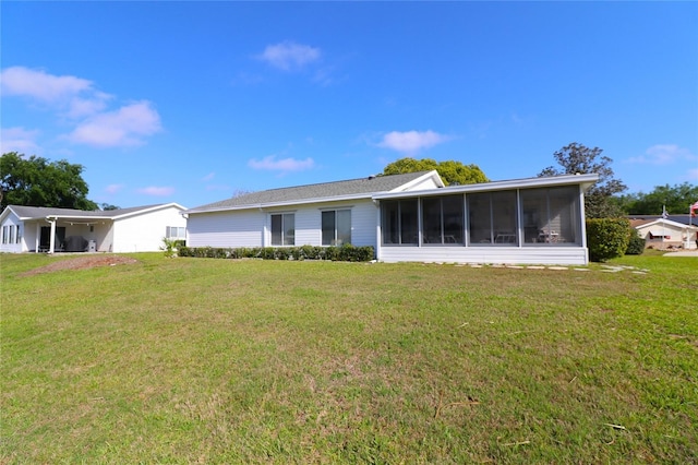 9948 SE 175th Pl, Summerfield, FL 34491 - rear view of house with a sunroom and a yard