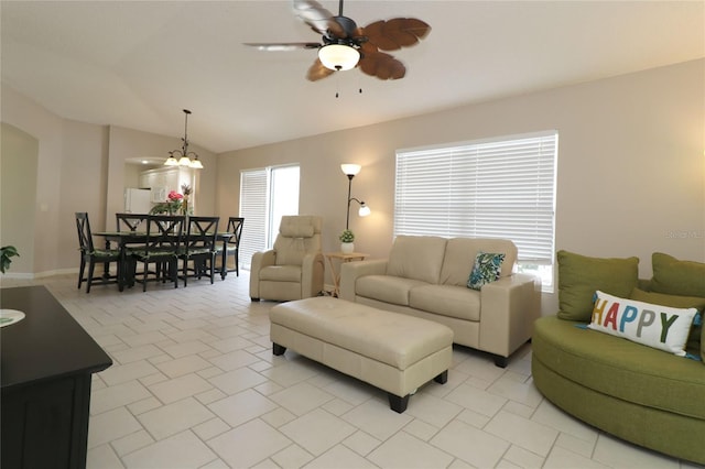 living room featuring a ceiling fan and lofted ceiling