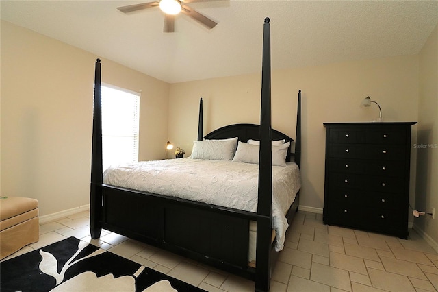 bedroom featuring baseboards and a ceiling fan
