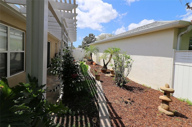 view of yard featuring a fenced backyard and a pergola