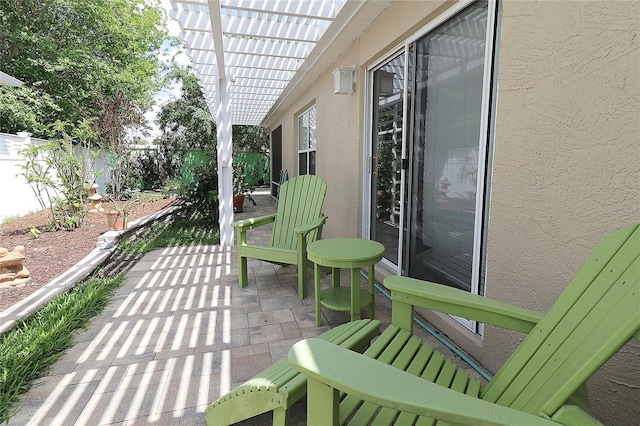 view of patio / terrace featuring a pergola and a fenced backyard