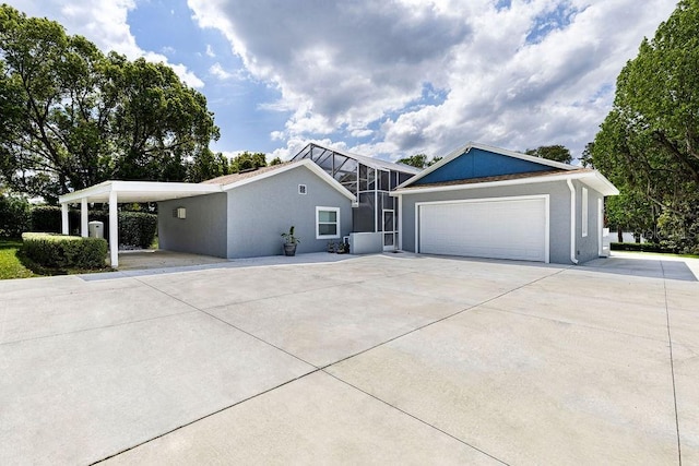 11619 Lane Park Rd, Tavares, FL 32778 - view of front facade featuring a garage, stucco siding, and concrete driveway
