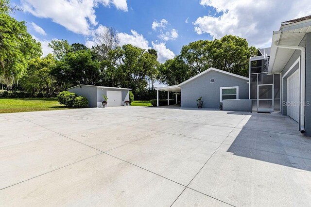 11619 Lane Park Rd, Tavares, FL 32778 - view of patio featuring an outdoor structure