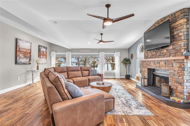 11619 Lane Park Rd, Tavares, FL 32778 - living room with lofted ceiling, ceiling fan, wood finished floors, and a fireplace