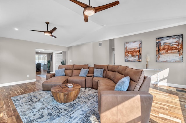 11619 Lane Park Rd, Tavares, FL 32778 - living room with a ceiling fan, vaulted ceiling, and wood finished floors