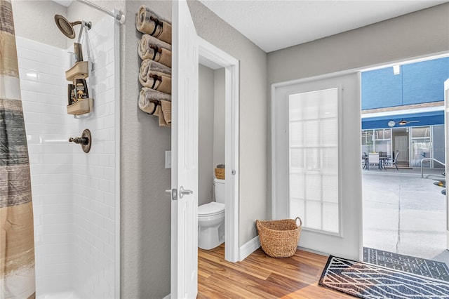 11619 Lane Park Rd, Tavares, FL 32778 - bathroom with a stall shower and wood finished floors