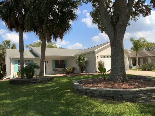 664 San Pedro Dr, The Villages, FL 32159 - ranch-style house featuring stucco siding, a front yard, driveway, and a garage