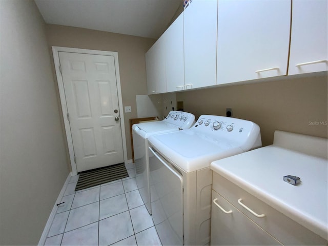 664 San Pedro Dr, The Villages, FL 32159 - washroom with baseboards, separate washer and dryer, cabinet space, and light tile patterned floors
