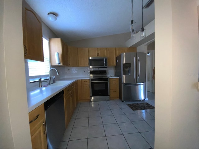 664 San Pedro Dr, The Villages, FL 32159 - kitchen featuring light brown cabinetry, light countertops, a sink, and stainless steel appliances