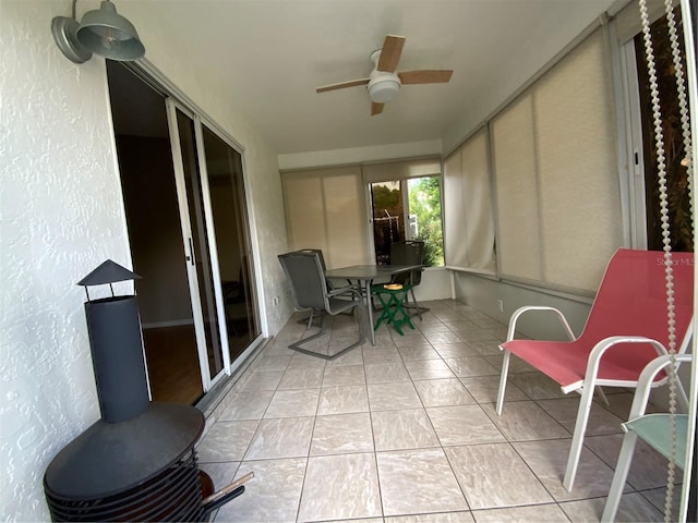 664 San Pedro Dr, The Villages, FL 32159 - sunroom / solarium with tile patterned flooring, a textured wall, and ceiling fan