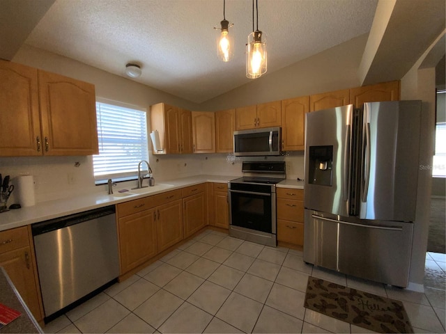 664 San Pedro Dr, The Villages, FL 32159 - kitchen featuring light brown cabinets, light countertops, a sink, and stainless steel appliances