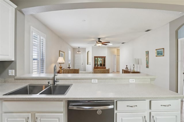 kitchen featuring light countertops, a sink, ceiling fan, dishwasher, and visible vents