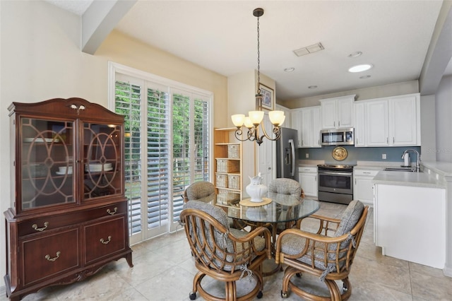 dining area with visible vents, recessed lighting, and a chandelier