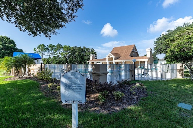 exterior space with a lawn and fence