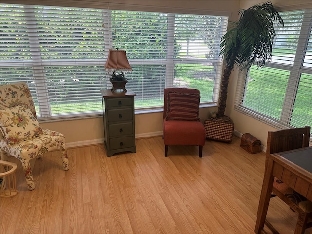 725 Beldon Ct, The Villages, FL 32162 - sitting room with baseboards and light wood-style flooring