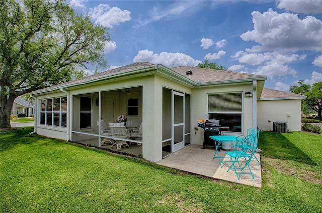725 Beldon Ct, The Villages, FL 32162 - back of property with a patio area, a lawn, a sunroom, and roof with shingles