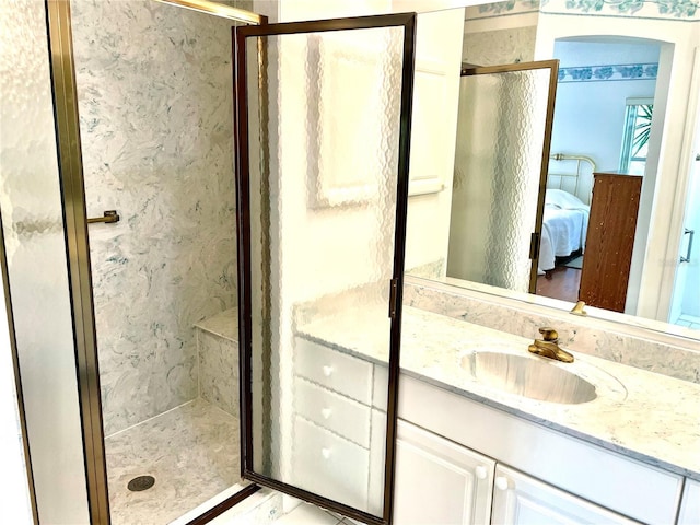full bathroom with connected bathroom, a stall shower, and vanity