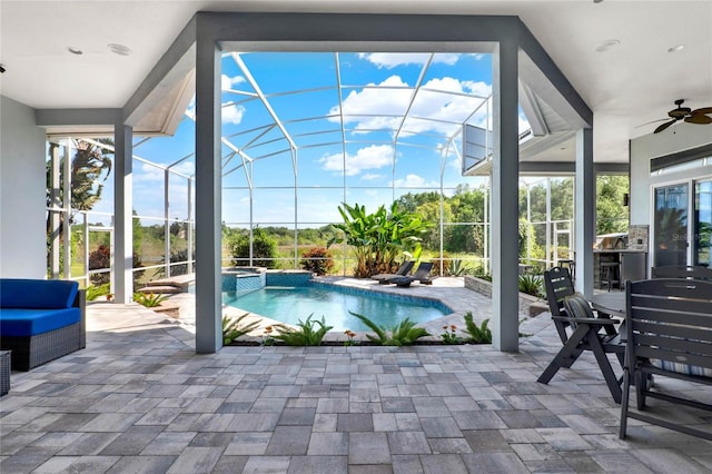 13112 Luntz Point Ln, Windermere, FL 34786 - view of swimming pool featuring ceiling fan, a patio, a pool with connected hot tub, and glass enclosure