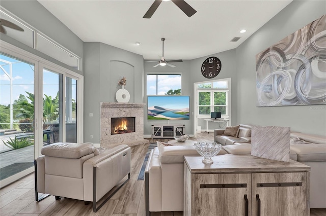 13112 Luntz Point Ln, Windermere, FL 34786 - living area featuring ceiling fan, wood finished floors, a high end fireplace, and recessed lighting