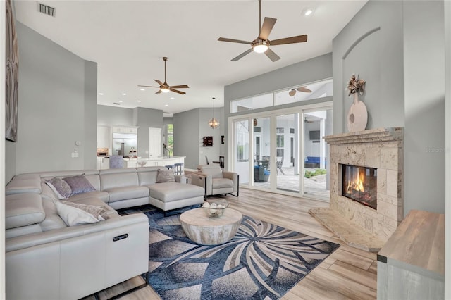 13112 Luntz Point Ln, Windermere, FL 34786 - living area with ceiling fan, wood finished floors, a premium fireplace, and recessed lighting