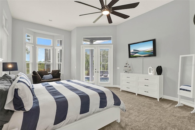 13112 Luntz Point Ln, Windermere, FL 34786 - bedroom with french doors, access to outside, light carpet, baseboards, and multiple windows