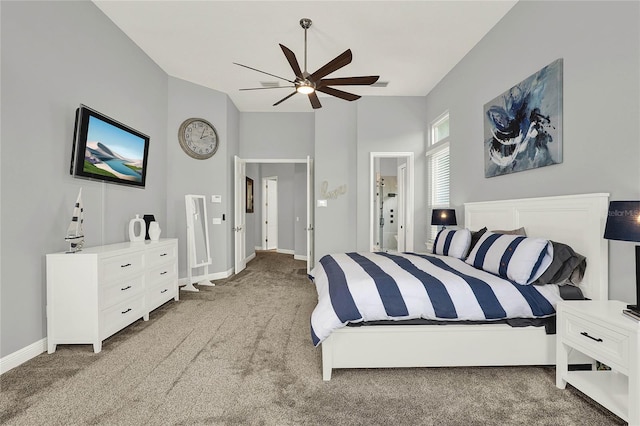 13112 Luntz Point Ln, Windermere, FL 34786 - bedroom with carpet flooring, lofted ceiling, baseboards, and ceiling fan