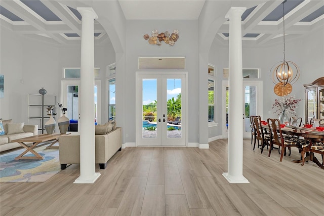 13112 Luntz Point Ln, Windermere, FL 34786 - foyer entrance with coffered ceiling, a high ceiling, french doors, beamed ceiling, and light wood-type flooring
