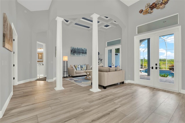 13112 Luntz Point Ln, Windermere, FL 34786 - foyer with french doors, a high ceiling, decorative columns, coffered ceiling, and baseboards