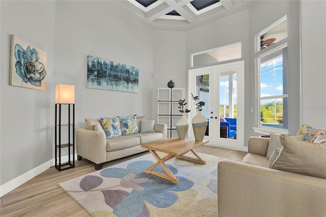 13112 Luntz Point Ln, Windermere, FL 34786 - living area featuring a high ceiling, french doors, baseboards, light wood finished floors, and coffered ceiling