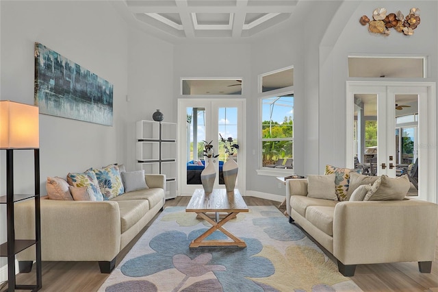 13112 Luntz Point Ln, Windermere, FL 34786 - living area with french doors, a towering ceiling, wood finished floors, coffered ceiling, and beam ceiling