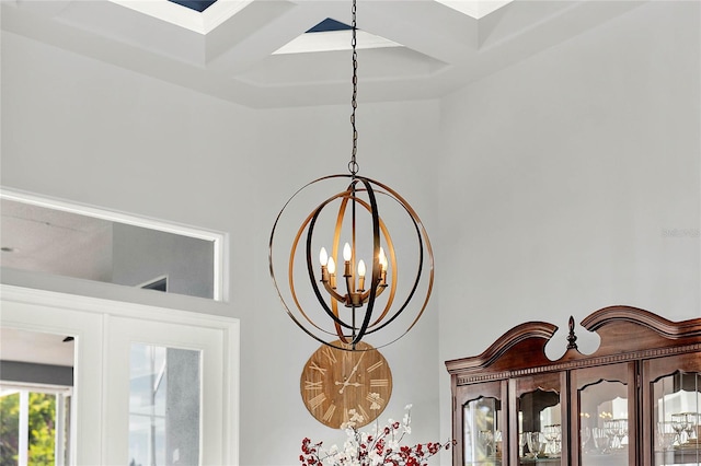 13112 Luntz Point Ln, Windermere, FL 34786 - detailed view of a chandelier, coffered ceiling, beamed ceiling, and a skylight