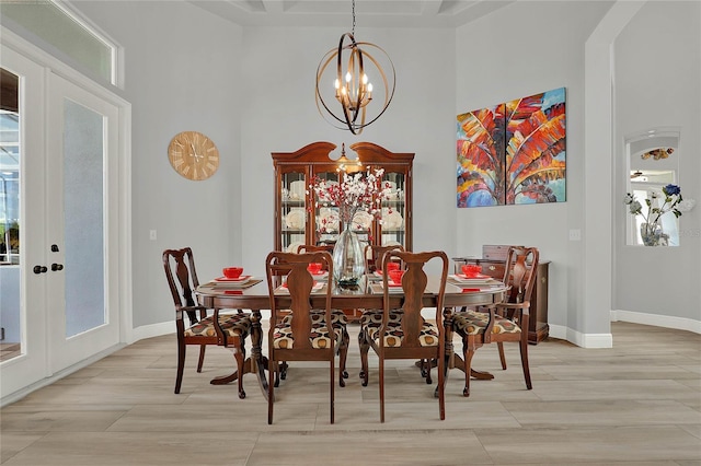 13112 Luntz Point Ln, Windermere, FL 34786 - dining space featuring a towering ceiling, a chandelier, french doors, and healthy amount of natural light