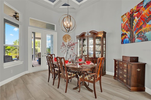 13112 Luntz Point Ln, Windermere, FL 34786 - dining room with a high ceiling, french doors, coffered ceiling, a chandelier, and baseboards