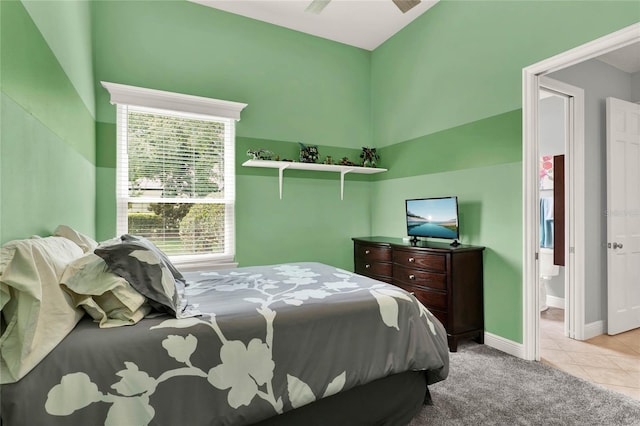 13112 Luntz Point Ln, Windermere, FL 34786 - tiled bedroom featuring baseboards, carpet flooring, and ensuite bathroom