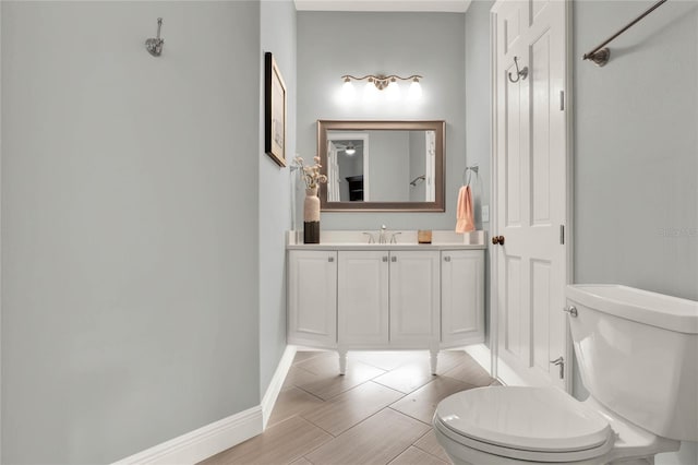 13112 Luntz Point Ln, Windermere, FL 34786 - bathroom featuring toilet, vanity, and baseboards