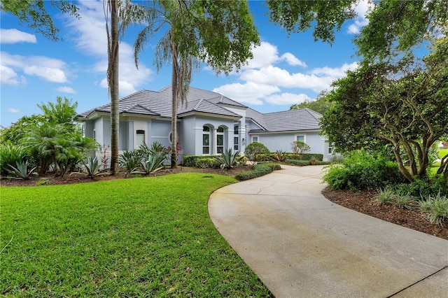 13112 Luntz Point Ln, Windermere, FL 34786 - view of front of house featuring stucco siding and a front yard