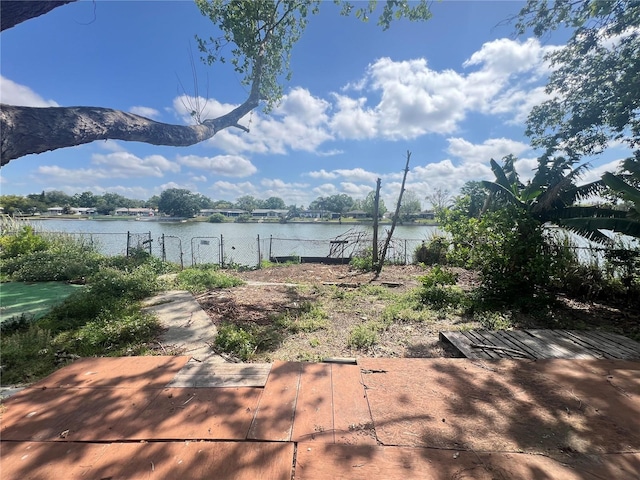 10228 Amadeus Dr, Port Richey, FL 34668 - view of yard with a water view and fence