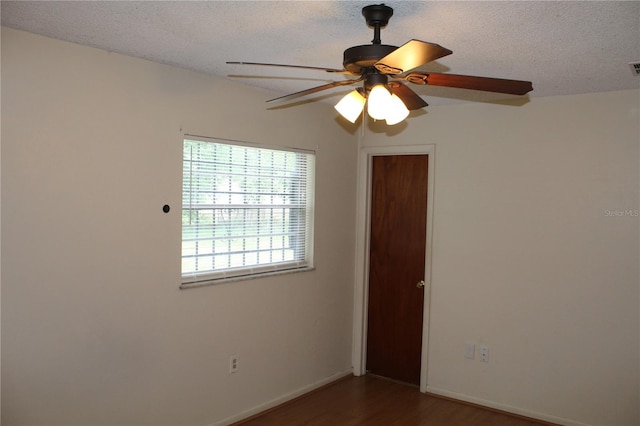 5177 Edwina St, Orlando, FL 32811 - empty room featuring baseboards, a textured ceiling, visible vents, a ceiling fan, and wood finished floors