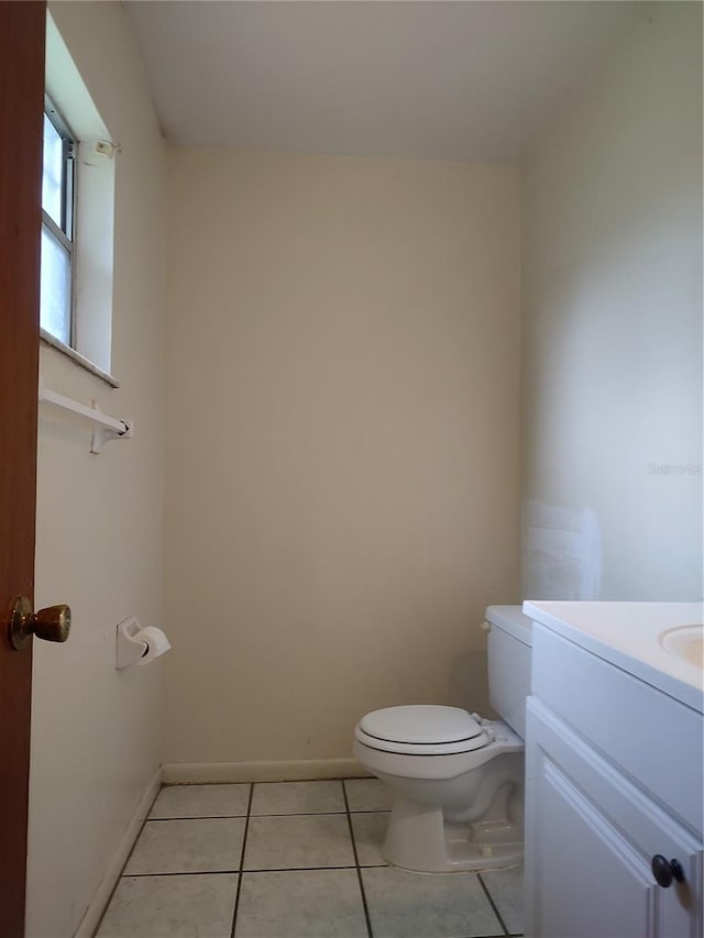 5177 Edwina St, Orlando, FL 32811 - bathroom featuring baseboards, toilet, tile patterned flooring, and vanity