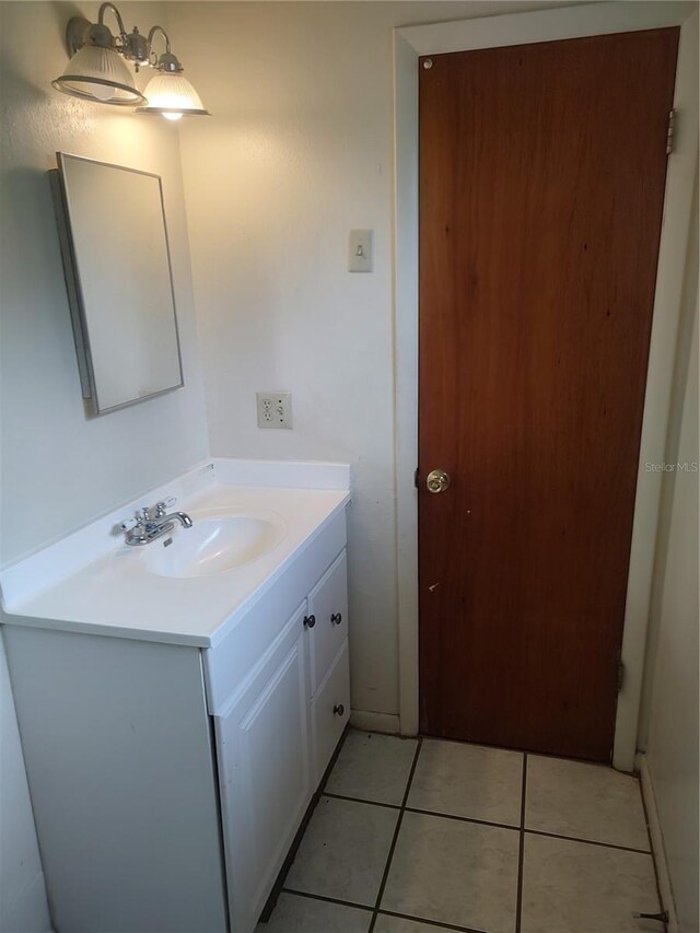 5177 Edwina St, Orlando, FL 32811 - bathroom featuring tile patterned flooring and vanity