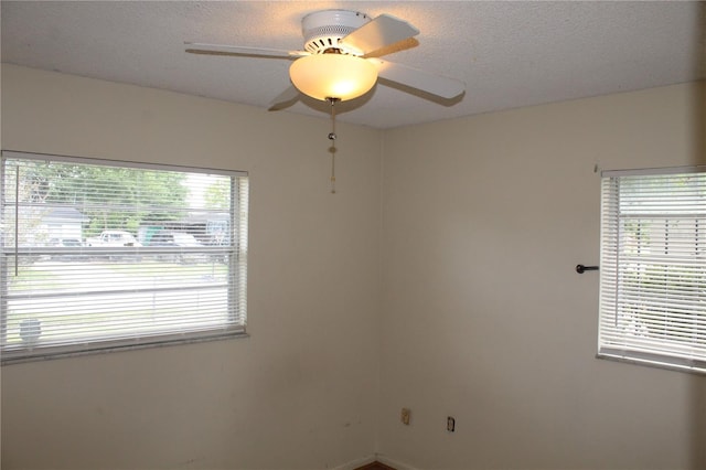 5177 Edwina St, Orlando, FL 32811 - unfurnished room featuring a textured ceiling and a ceiling fan