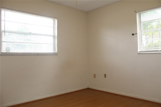 5177 Edwina St, Orlando, FL 32811 - empty room with baseboards and light wood-style floors
